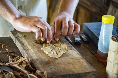 Midsection of man working in workshop