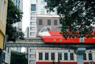 A view of a monorail train on elevated tracks in the city