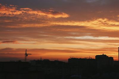 Silhouette of city during sunset