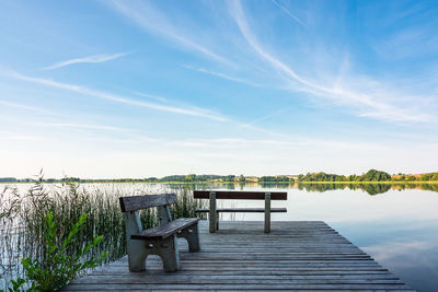 Pier over lake against sky