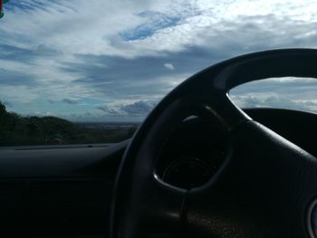 Close-up of car against sky