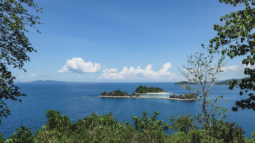 Scenic view of sea against blue sky