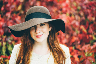 Portrait of young woman wearing hat