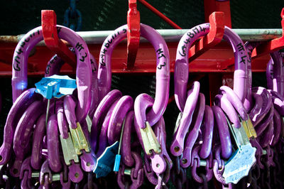 Close-up of multi colored decorations hanging on metal