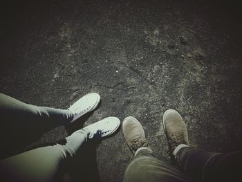 Low section of man wearing shoes