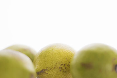 Close-up of fruits against white background