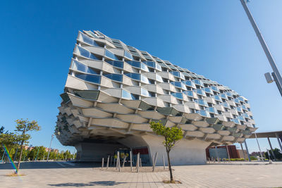 Low angle view of building against clear blue sky