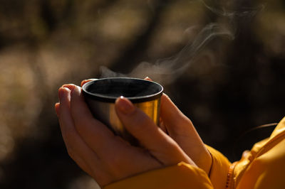 Close-up of hand holding drink