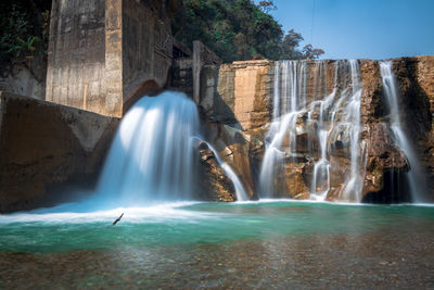 View of waterfall in sea