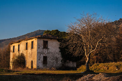 Old building against clear blue sky