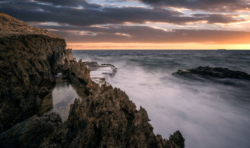 Scenic view of sea against sky during sunset