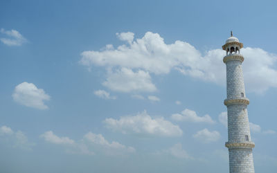 Low angle view of building against cloudy sky
