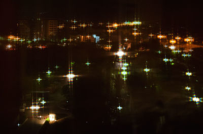 Aerial view of illuminated city at night