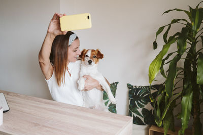 Man photographing with dog