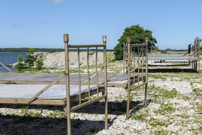 Built structure on beach against clear sky