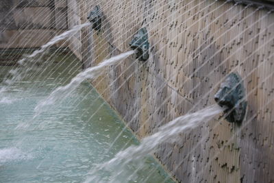 Water splashing against blurred background