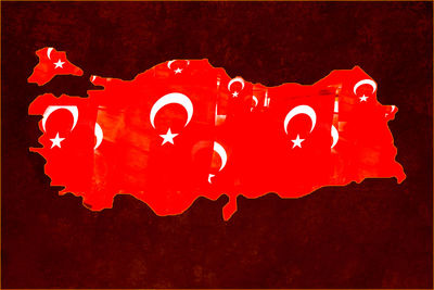 Close-up of text against red wall