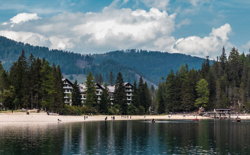 Panoramic view of lake and trees against sky