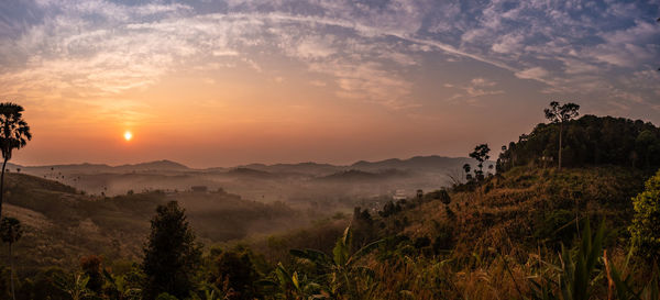 Scenic view of mountains against sky during sunset