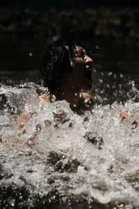 Portrait of woman swimming in water