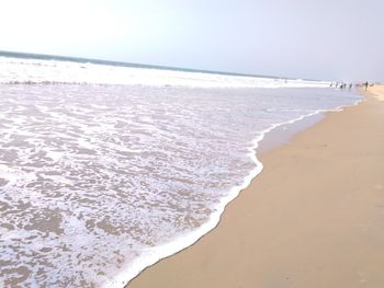 Scenic view of beach against clear sky