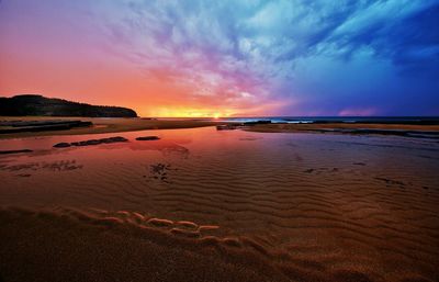 Scenic view of sea at sunset