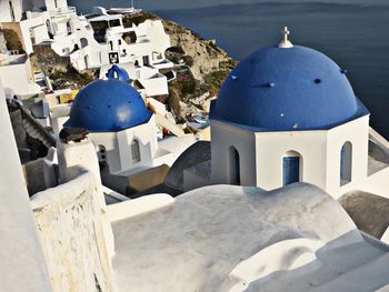 High angle view of temple and building against blue sky