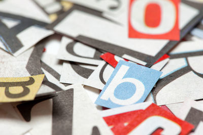 Full frame shot of alphabets on papers