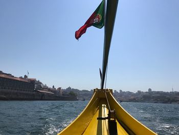 Low angle view of flag against clear sky