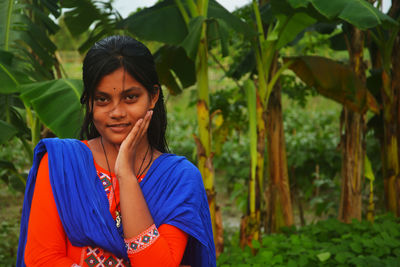 Portrait of young woman in park