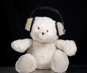 Close-up of stuffed toy against black background