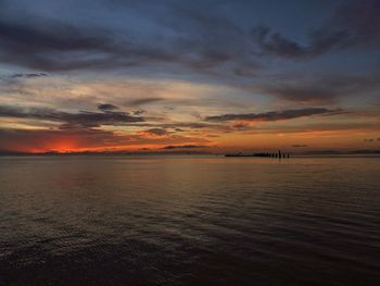 Scenic view of sea against romantic sky at sunset