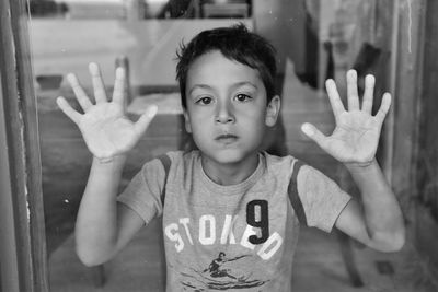 Portrait of cute boy standing outdoors