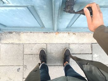 Directly above shot of person holding door knob