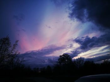 Silhouette trees against sky during sunset