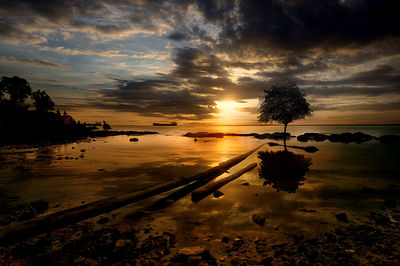 Scenic view of lake against sky during sunset