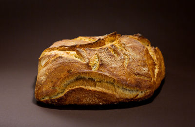 Close-up of bread against black background