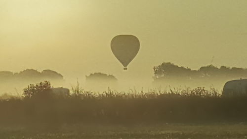 Silhouette of hot air balloon against clear sky