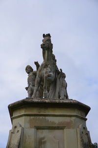 Low angle view of statue against sky