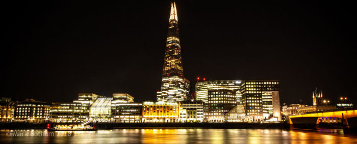 Illuminated buildings in city at night