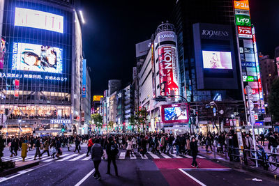 Side view of people crossing road