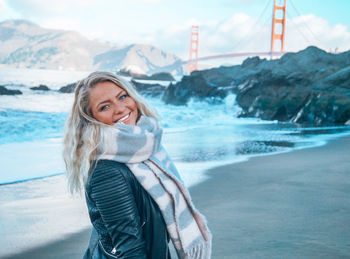 Portrait of smiling young woman in winter