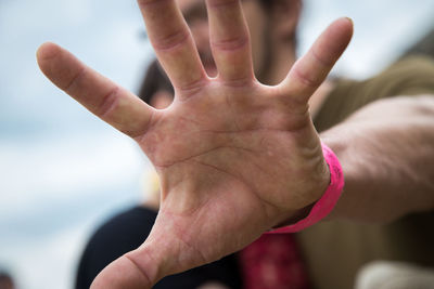 Close-up of hand holding text