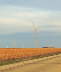 Wind turbines on field