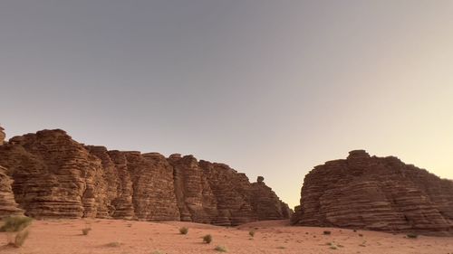 Rock formations in desert against clear sky