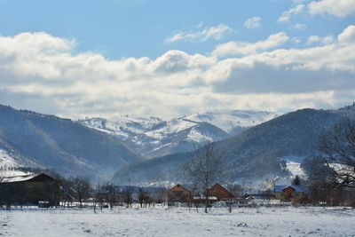 Scenic view of snowcapped mountains against sky