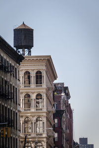 Low angle view of buildings against clear sky