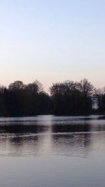 Scenic view of calm lake at sunset