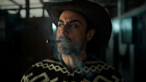 Cowboy smoke a cigar