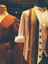 Close-up of clothes hanging in store